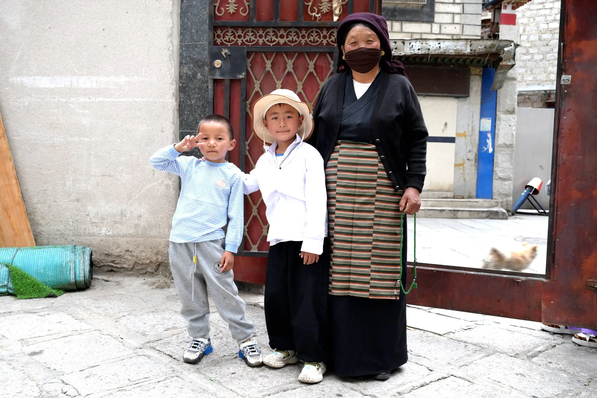 The kids in old market, Lhasa who gladly posed with their mama